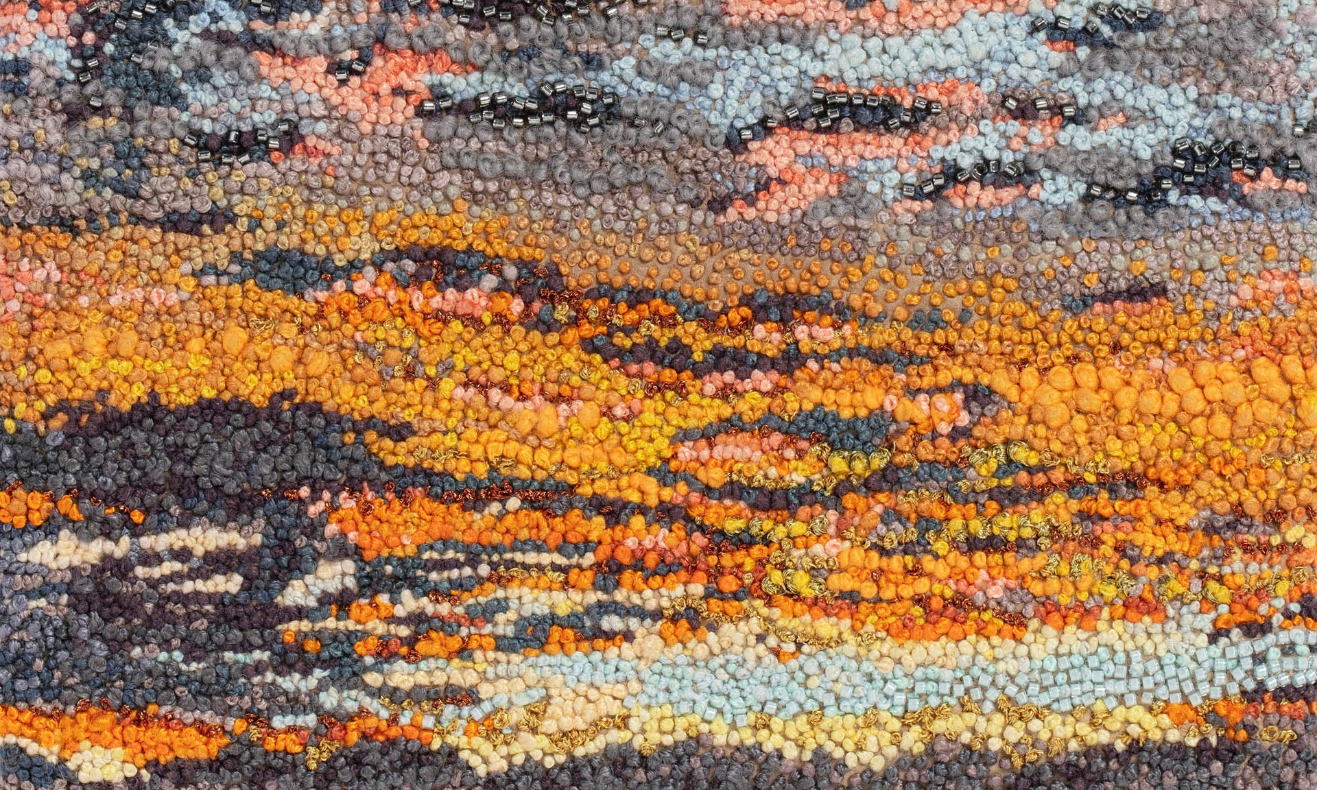 June sky hand embroidered artwork close up.