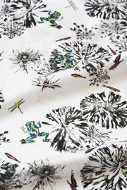 Botanical fabric with green frogs, dragon flies and fish.