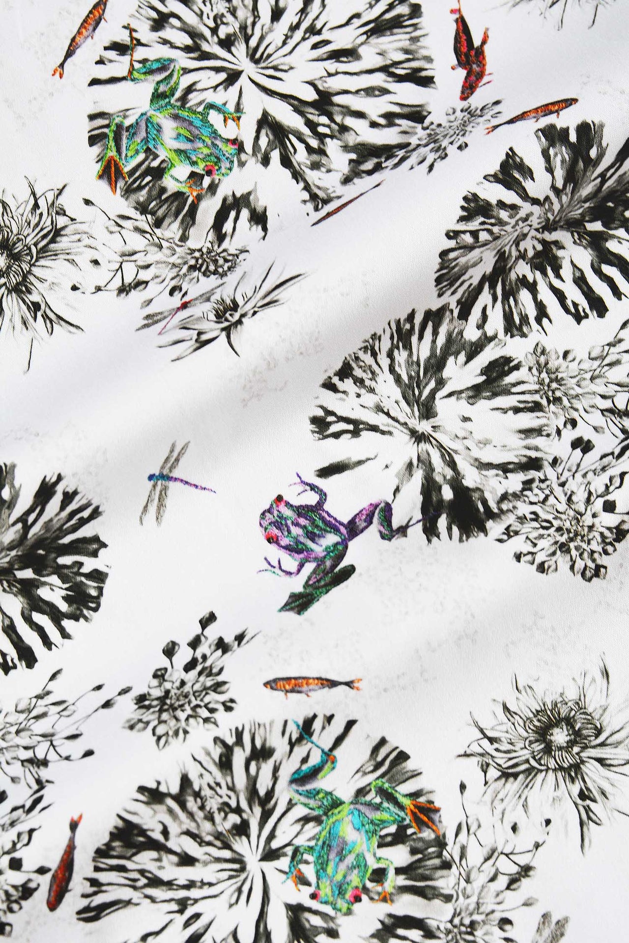 Botanical fabric with green and purple frogs, dragon flies and fish.