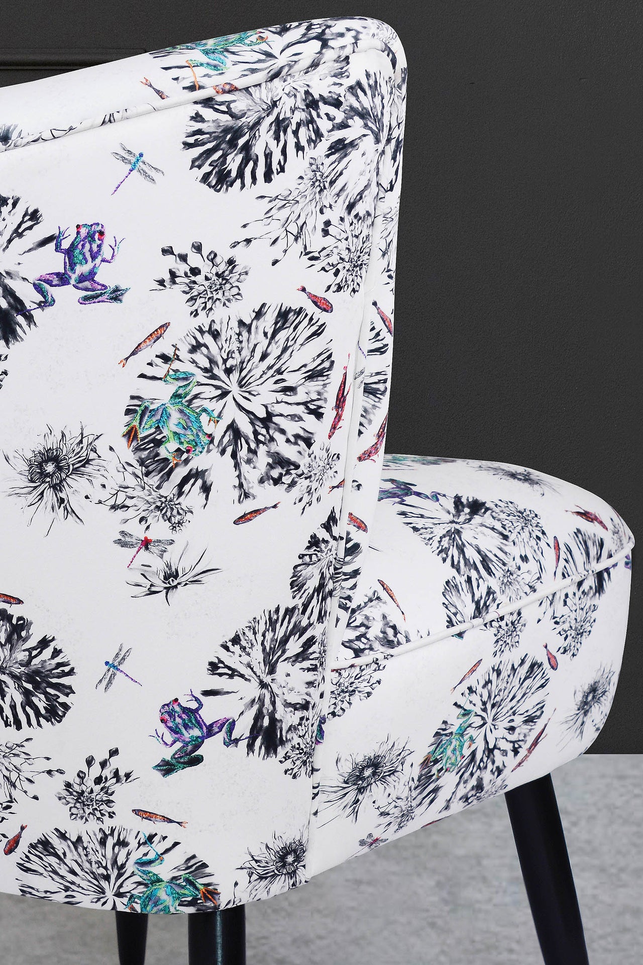 Cocktail chair upholstered with botanical frogs fabric.